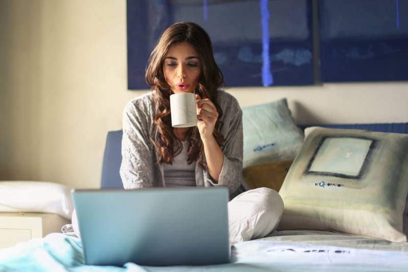 Woman reading Good morning quotes on her laptop