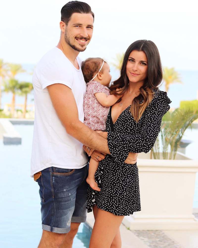 Mathew Leckie and his wife Laura Friese with their little daughter