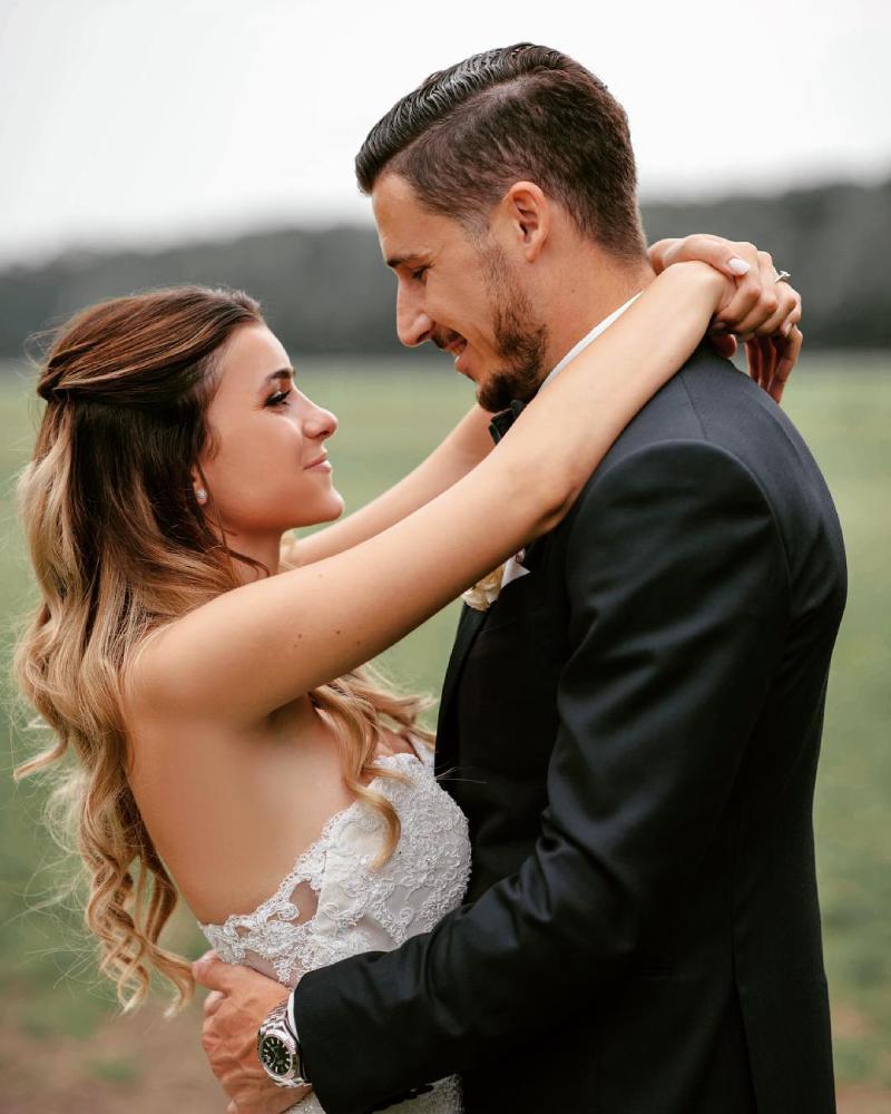 Mathew Leckie with his wife Laura Friese on their wedding