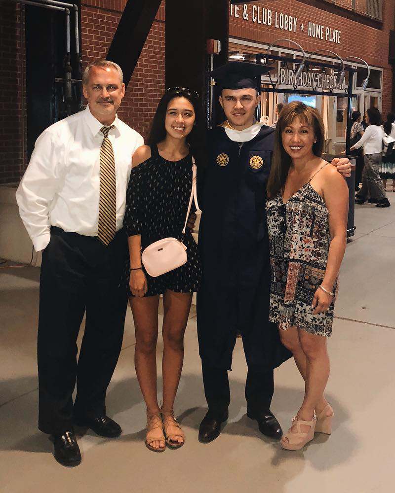 Natalie Pluto with her father, brother and mother