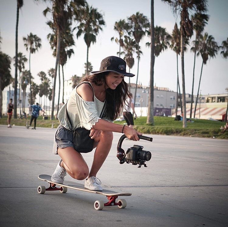 Natalie Pluto on her longboard/skateboard