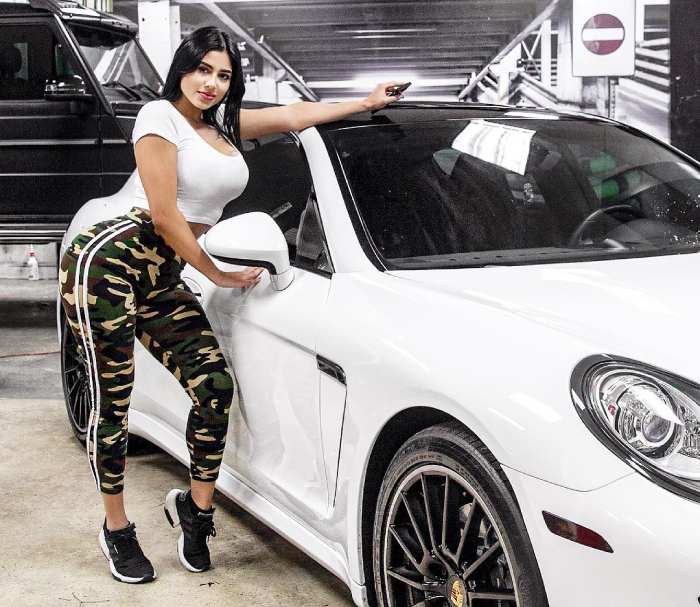 Mia Francis next to her white Porsche