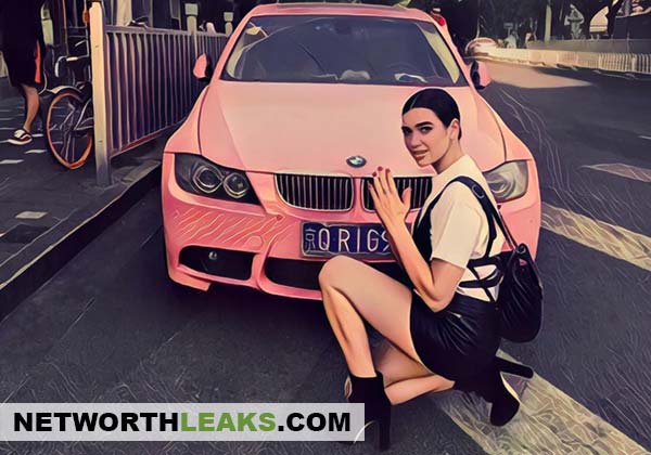 Dua Lipa next to a pink BMW